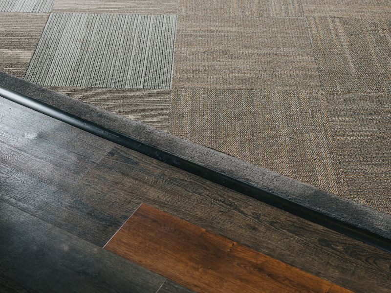 Close view of carpet tile and wood-look flooring materials