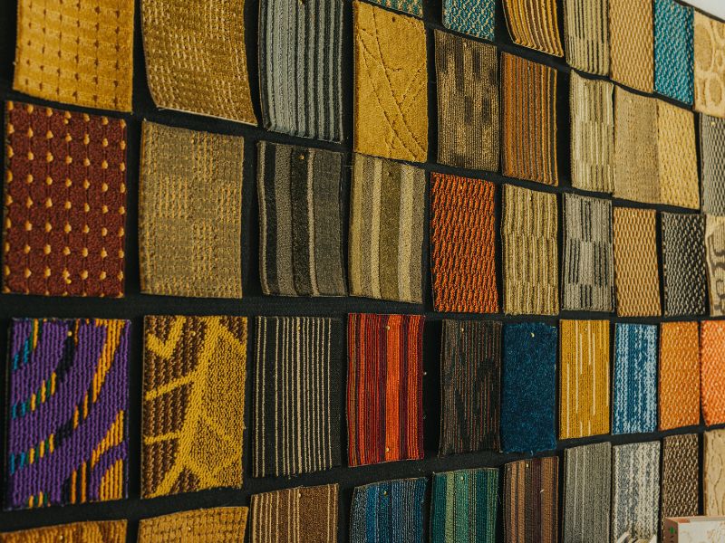 Wide display of carpet material swatches